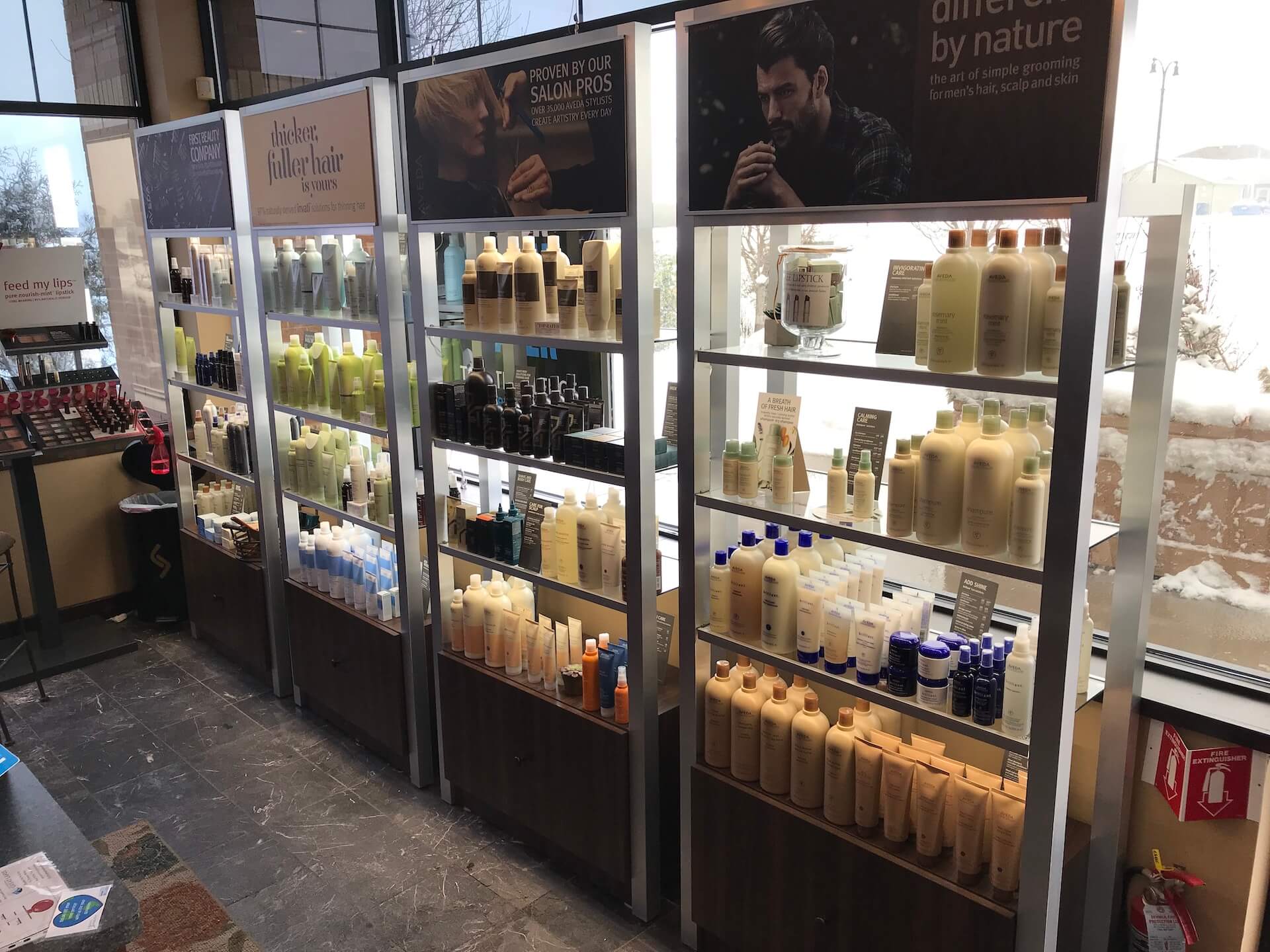 A custom retail display for hair care products in a store.